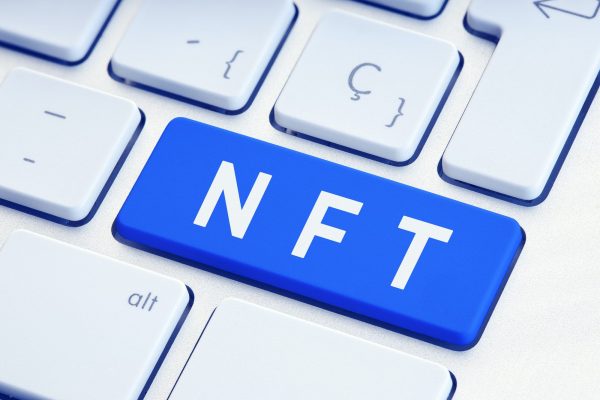 NFT text on blue computer Keyboard Key